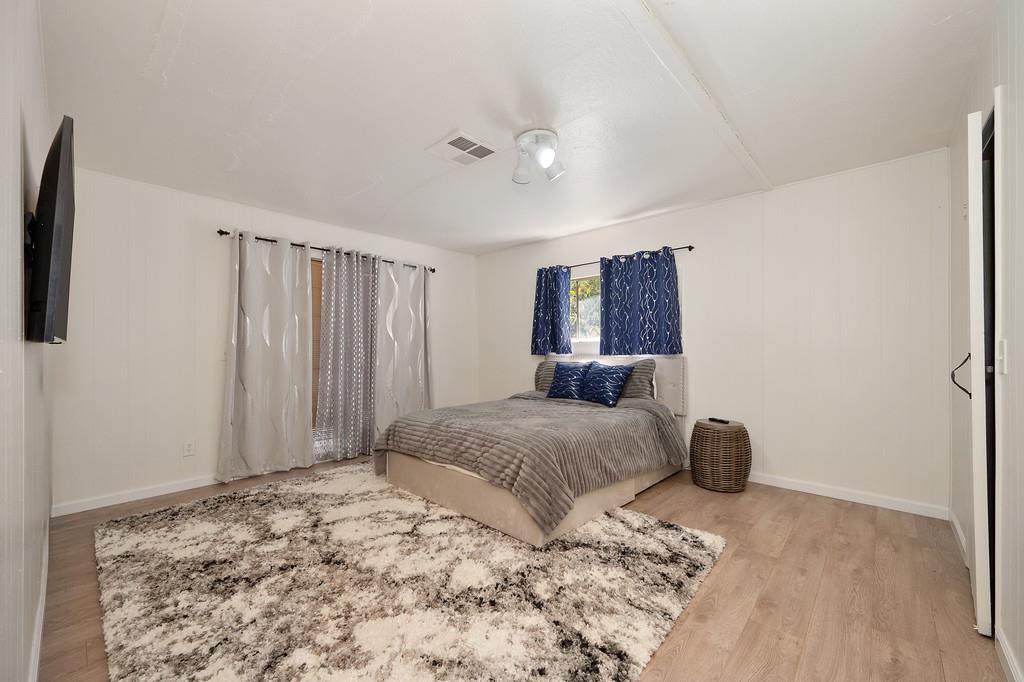 333 Pine Street Colfax, CA 95713 - Photo 15 of 65 a bedroom with a large bed and a window