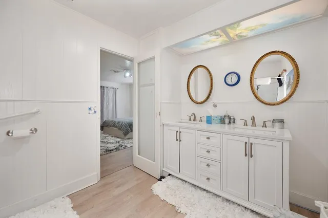 a view of a walk in closet and bathroom