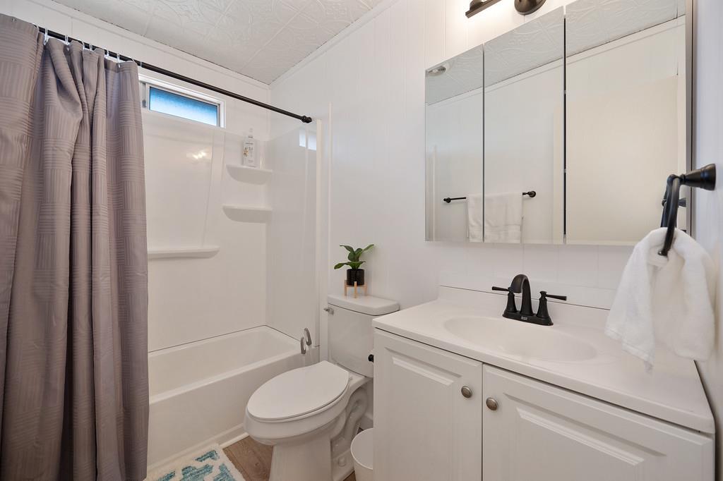 333 Pine Street Colfax, CA 95713 - Photo 23 of 65 a bathroom with a sink a toilet and shower