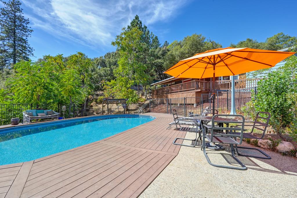 333 Pine Street Colfax, CA 95713 - Photo 30 of 65 a view of swimming pool with outdoor seating and plants