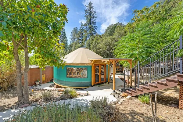 a bathroom with a sink a toilet and a window
