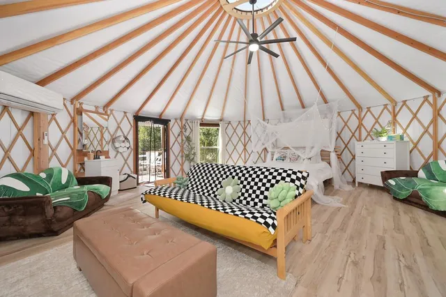 a view of a chairs and table in the patio