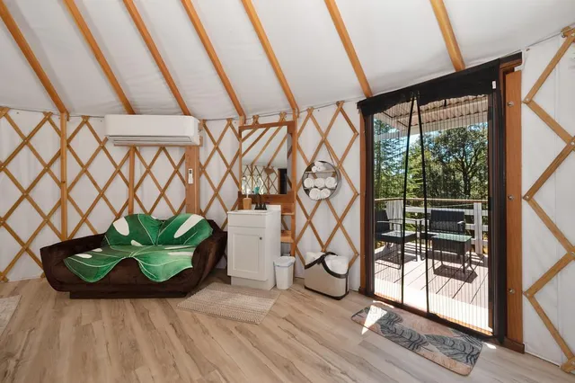 a view of a backyard with sitting area