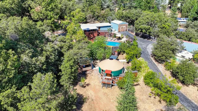 a view of a large room with wooden floor and windows