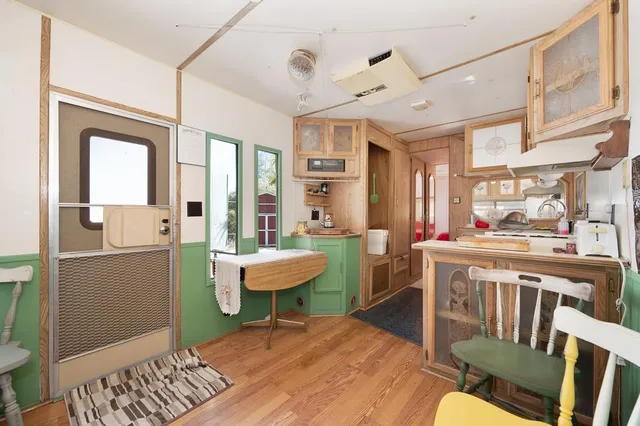 an aerial view of residential house with outdoor space and trees all around