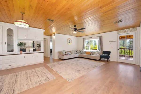 a kitchen with stainless steel appliances granite countertop a sink stove a microwave and cabinets