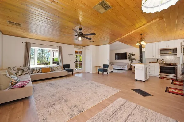 a kitchen with a sink appliances and cabinets