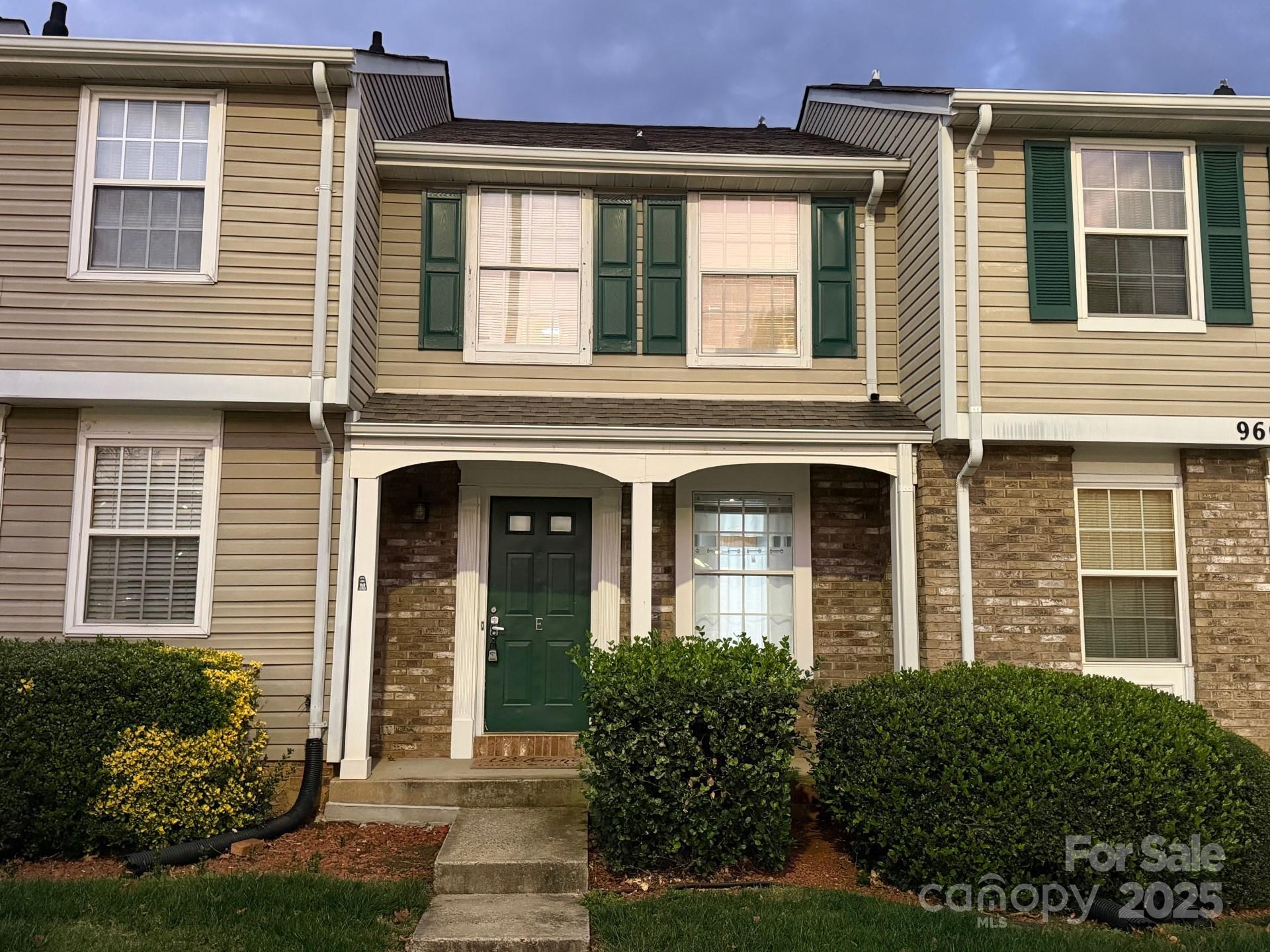 9606 Vinca Circle, Unit E Charlotte, NC 28213 - Photo 1 of 26 front view of a brick house