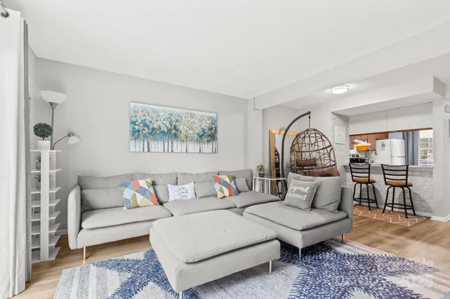 a living room with furniture and a table