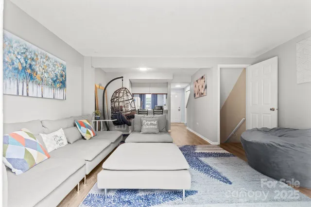 a living room with furniture and a rug