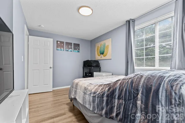 a bathroom with a sink vanity mirror and toilet