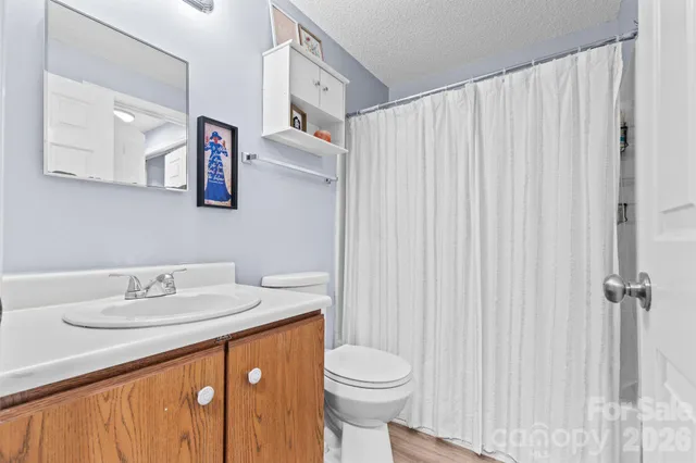 a bedroom with bed and window