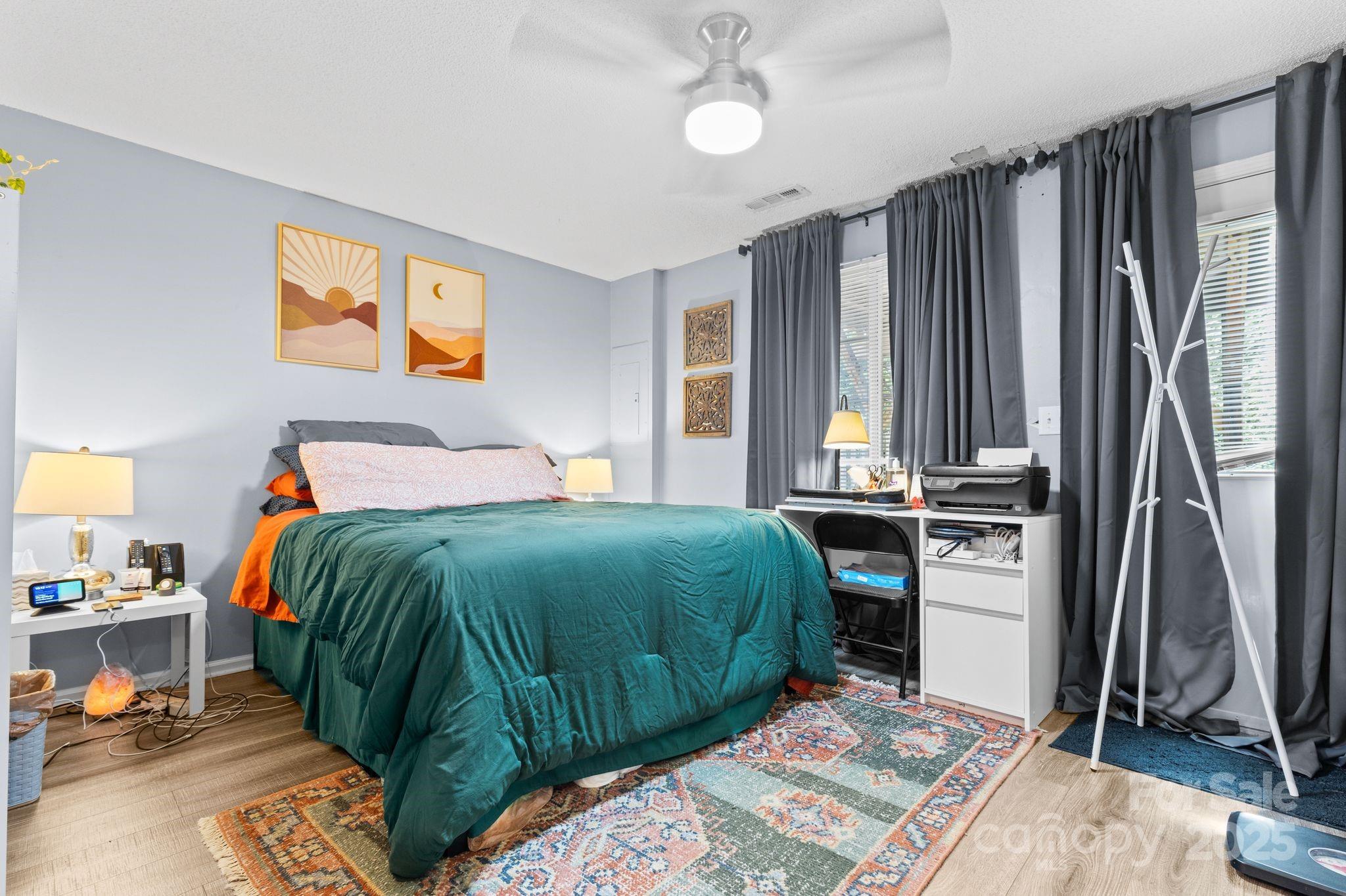 9606 Vinca Circle, Unit E Charlotte, NC 28213 - Photo 21 of 26 a bedroom with a bed and a window