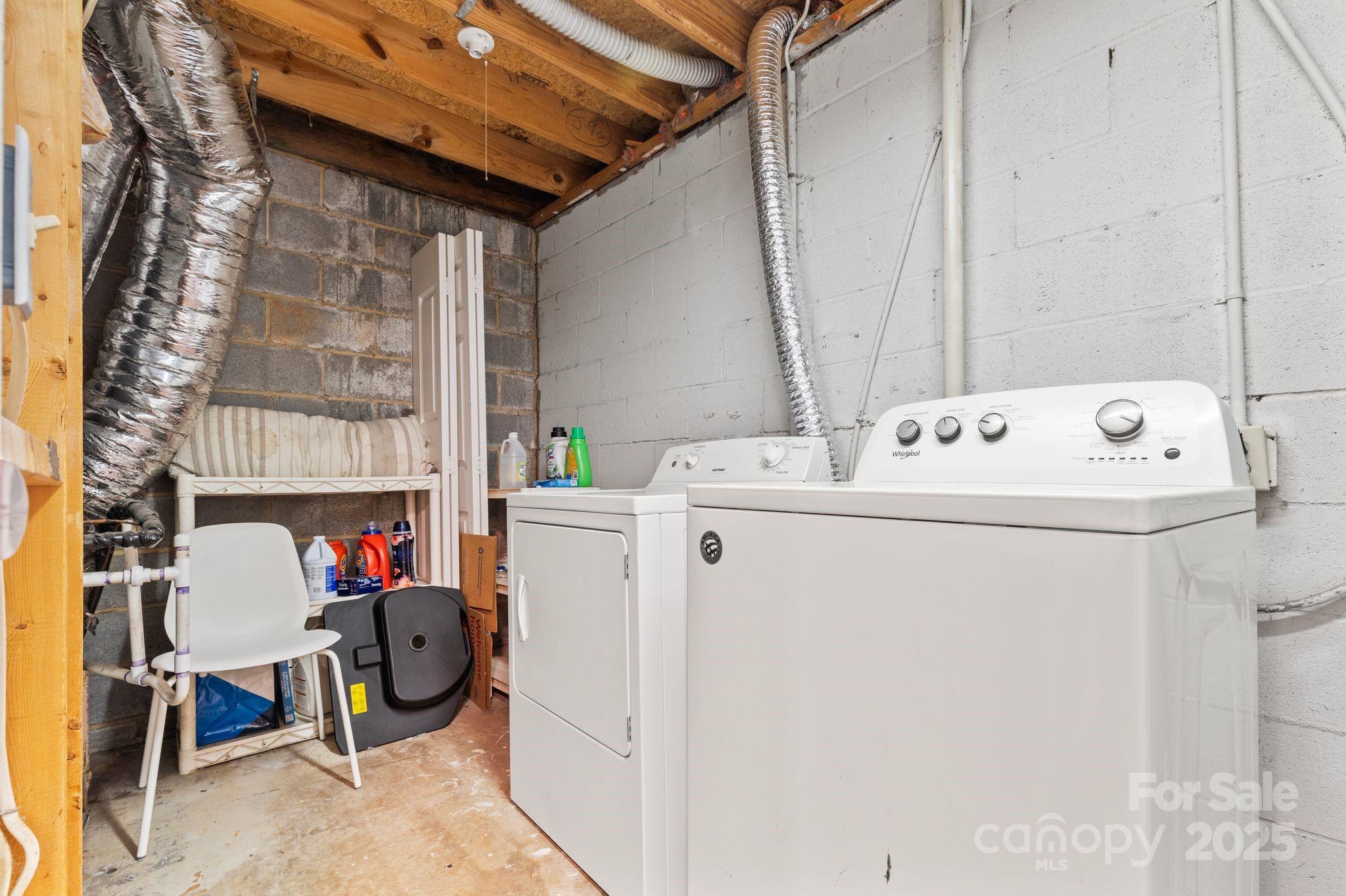 9606 Vinca Circle, Unit E Charlotte, NC 28213 - Photo 23 of 26 a utility room with dryer and washer