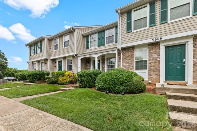 a view of a hallway with wooden floor and entryway