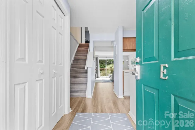 a kitchen with refrigerator a stove a sink and cabinets