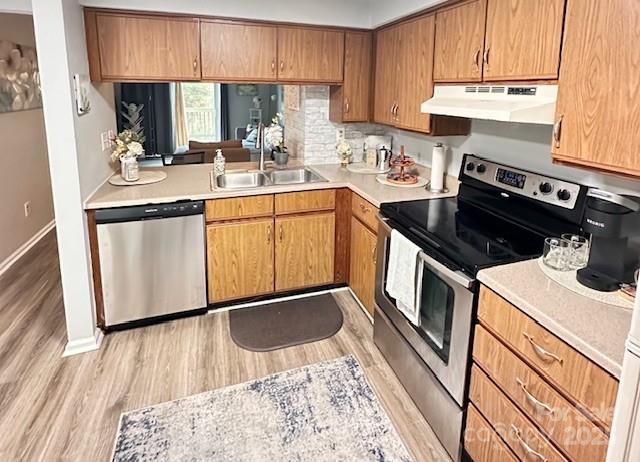 9606 Vinca Circle, Unit E Charlotte, NC 28213 - Photo 7 of 26 a kitchen with a sink stove and cabinets