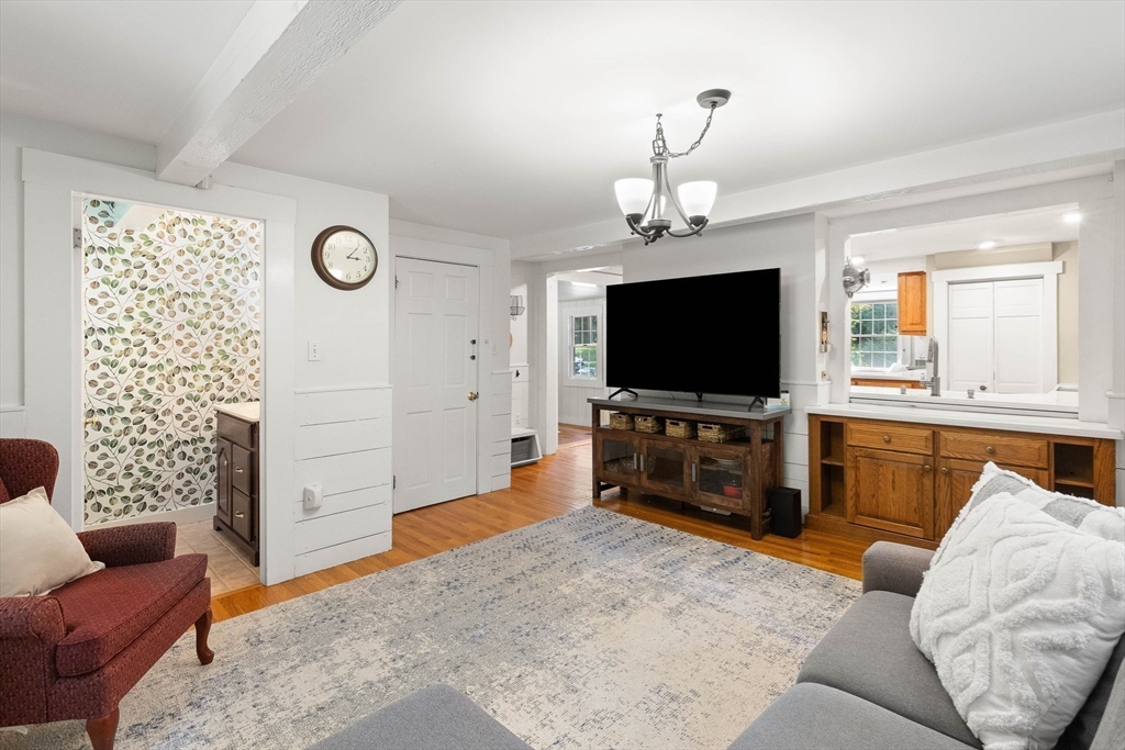 33 Bare Hill Road Topsfield, MA 01983 - Photo 12 of 40 a living room with furniture and a flat screen tv