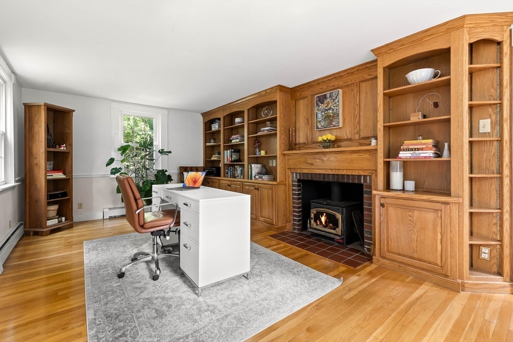 33 Bare Hill Road Topsfield, MA 01983 - Photo 14 of 40 a living room with furniture a fireplace and a table