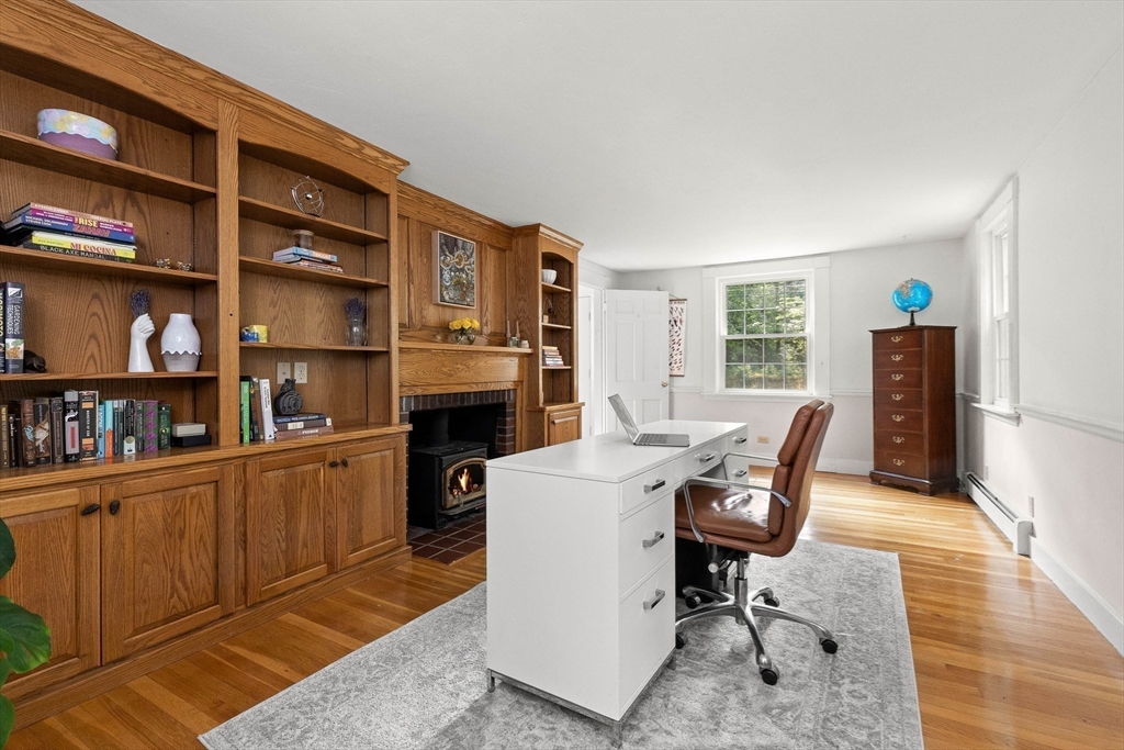 33 Bare Hill Road Topsfield, MA 01983 - Photo 15 of 40 a view of a workspace with furniture and a bookshelf