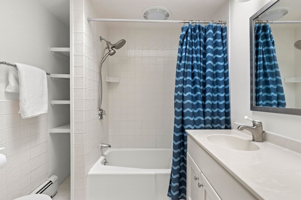 33 Bare Hill Road Topsfield, MA 01983 - Photo 18 of 40 a bathroom with a bathtub and shower