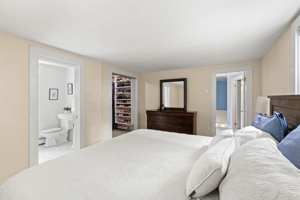33 Bare Hill Road Topsfield, MA 01983 - Photo 20 of 40 a bedroom with a large bed and a couch