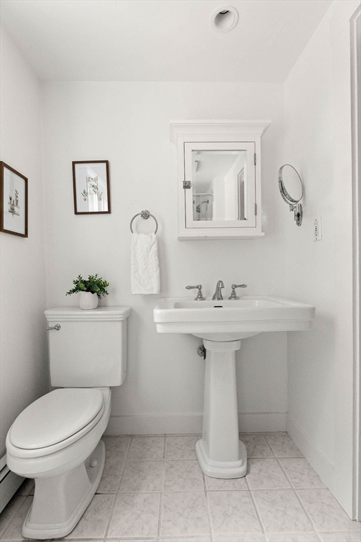 33 Bare Hill Road Topsfield, MA 01983 - Photo 21 of 40 a bathroom with a sink mirror and toilet