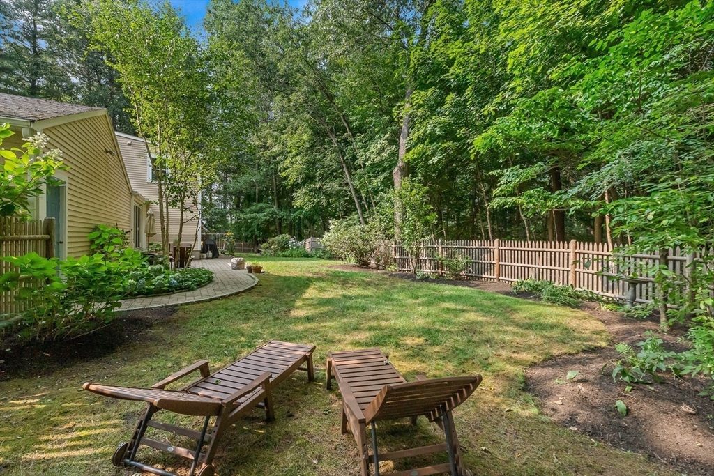 33 Bare Hill Road Topsfield, MA 01983 - Photo 29 of 40 a view of a wooden deck and a bench
