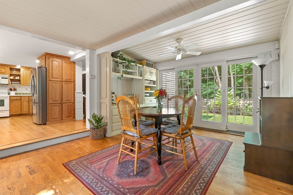 33 Bare Hill Road Topsfield, MA 01983 - Photo 3 of 40 a dining room with furniture a chandelier and wooden floor
