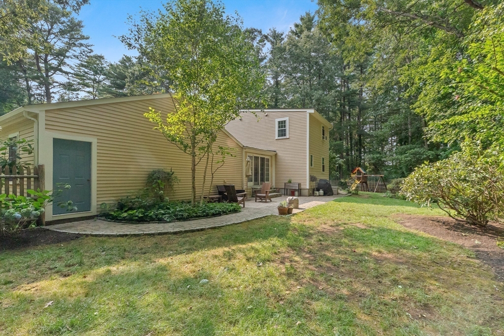 33 Bare Hill Road Topsfield, MA 01983 - Photo 32 of 40 a view of a house with backyard and sitting area