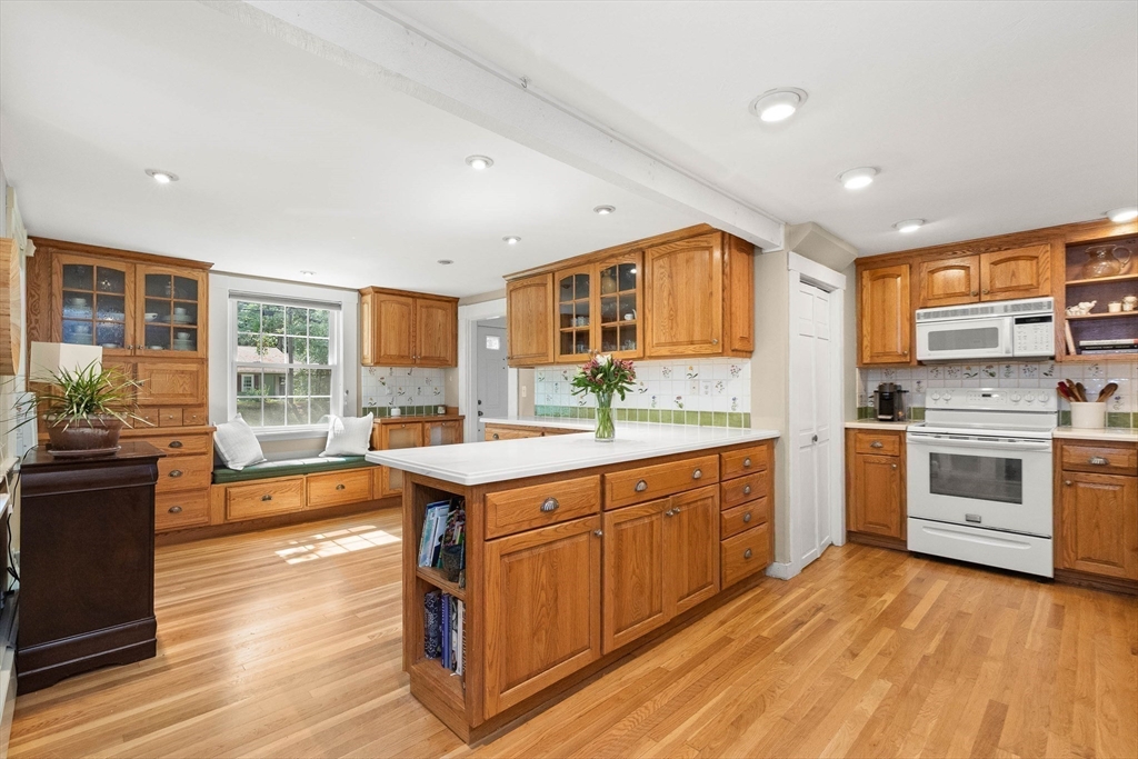 33 Bare Hill Road Topsfield, MA 01983 - Photo 6 of 40 a kitchen with stainless steel appliances granite countertop a stove and cabinets
