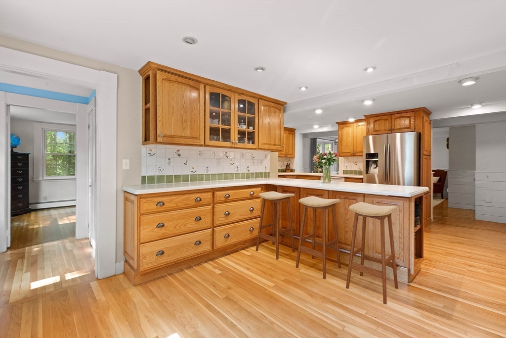 33 Bare Hill Road Topsfield, MA 01983 - Photo 7 of 40 a kitchen with a sink cabinets and wooden floor