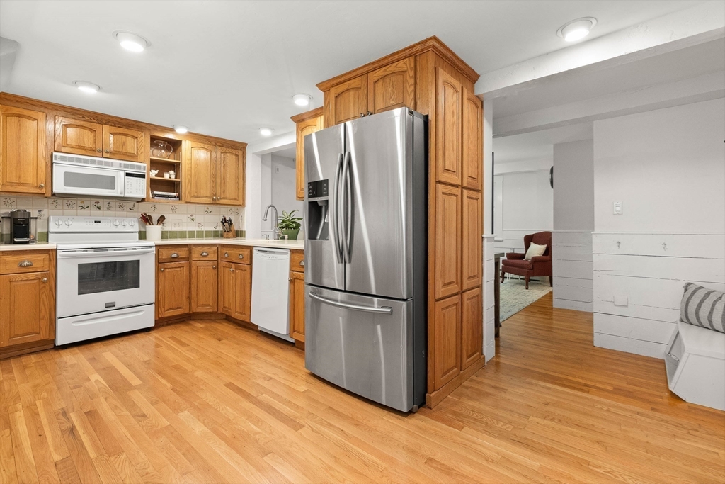 33 Bare Hill Road Topsfield, MA 01983 - Photo 10 of 40 a kitchen with stainless steel appliances a refrigerator and a stove top oven