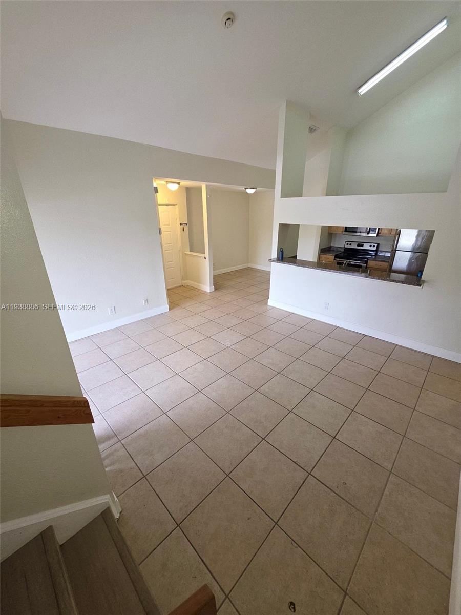 10451 Southwest 157th Place, Unit 305 Miami, FL 33196 - Photo 2 of 23 a view of kitchen and windows