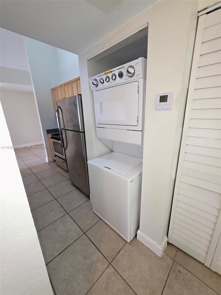 10451 Southwest 157th Place, Unit 305 Miami, FL 33196 - Photo 8 of 23 a utility room with dryer and washer
