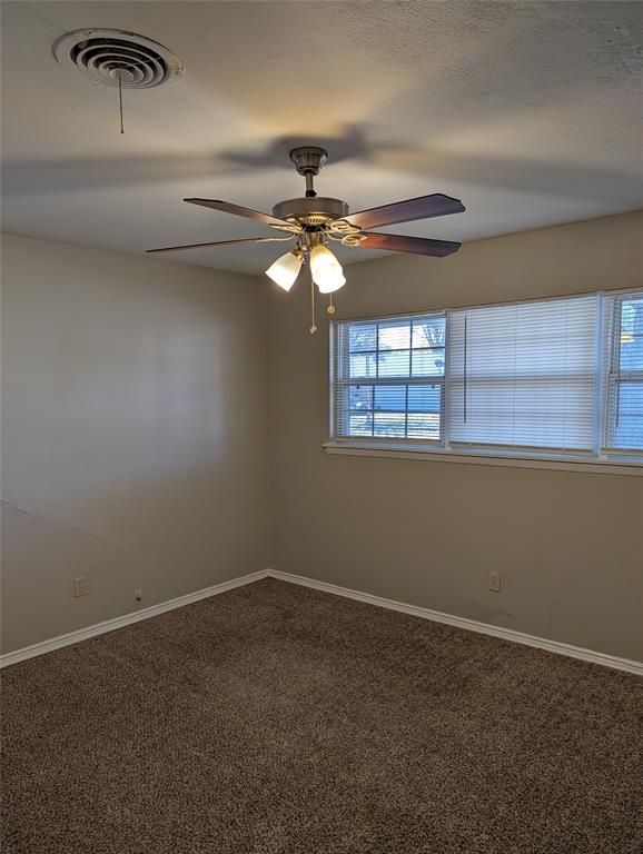 5521 Odessa Avenue Fort Worth, TX 76133 - Photo 11 of 21 a view of a livingroom with a ceiling fan and window