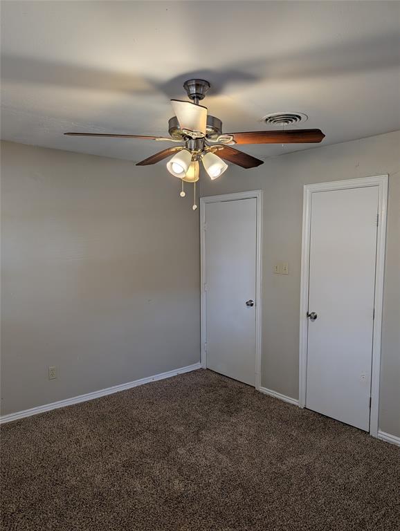5521 Odessa Avenue Fort Worth, TX 76133 - Photo 13 of 21 a view of a chandelier fan in a room