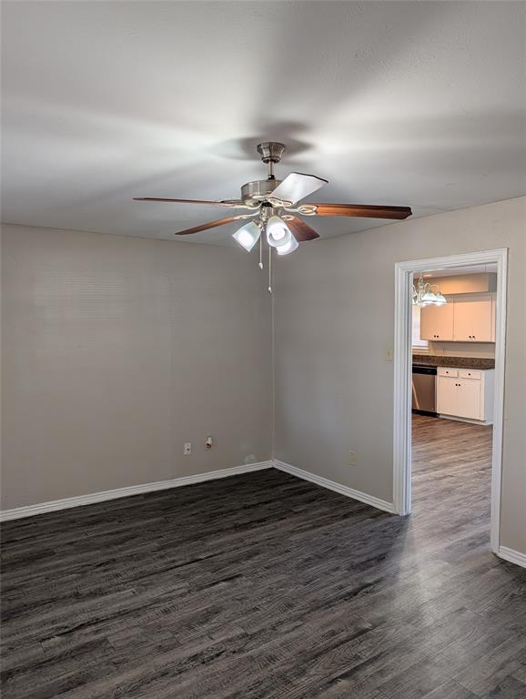 5521 Odessa Avenue Fort Worth, TX 76133 - Photo 2 of 21 wooden floor in an empty room with a window