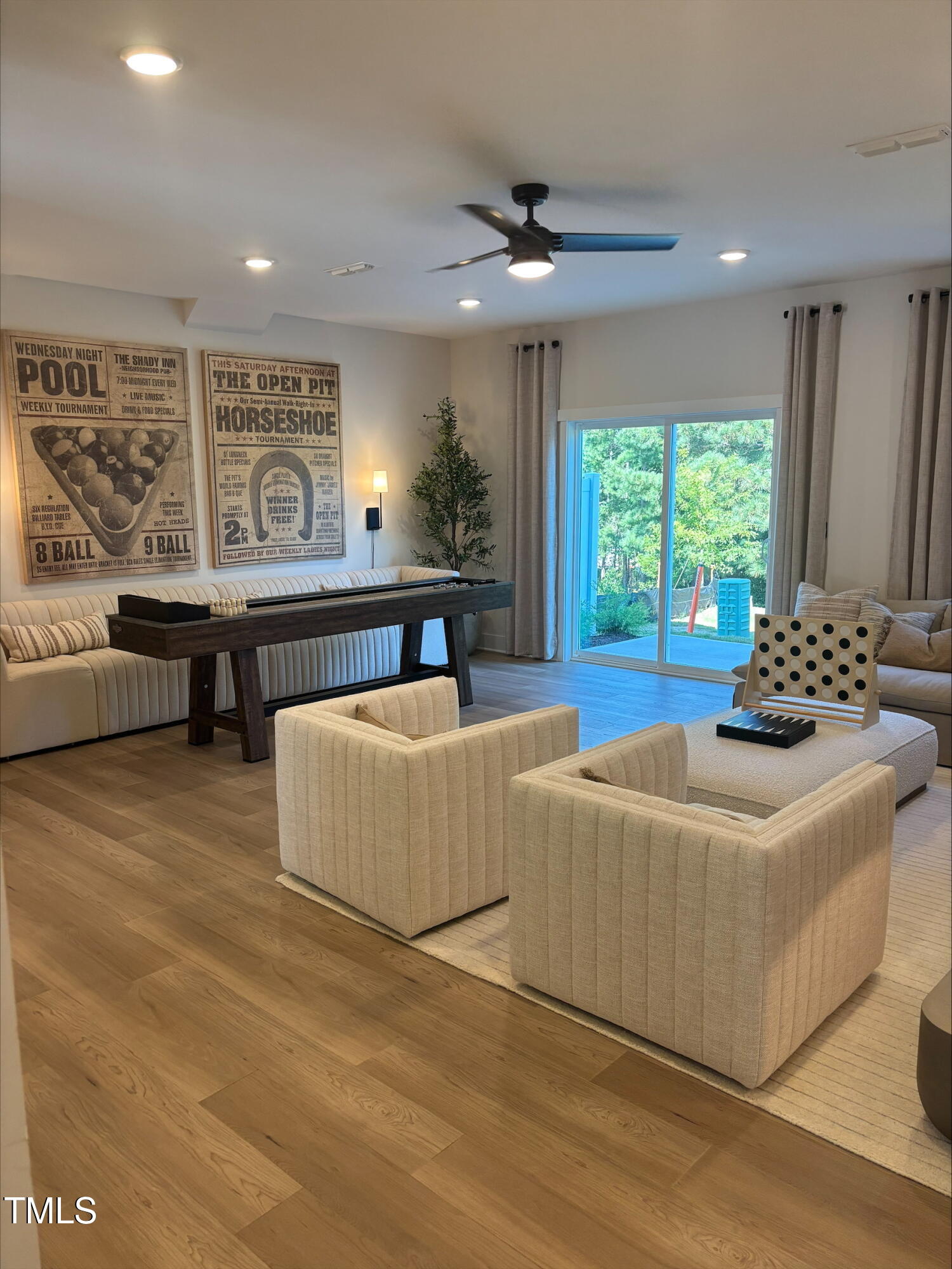 10901 Bayflower Way Raleigh, NC 27617 - Photo 3 of 12 a living room with furniture and a large window