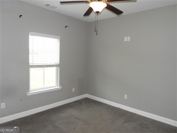5915 Rye Patch Road Ludowici, GA 31316 - Photo 25 of 25 an empty room with a window