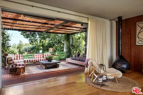 a view of a patio with a table and chairs