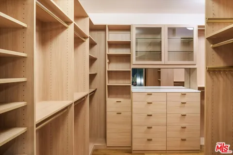 a hallway with a view of living room
