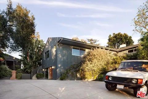 a car parked in front of a house