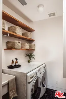 a view of a hallway with entryway wooden floor and front door