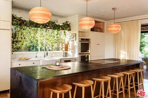 a kitchen with a sink and a stove