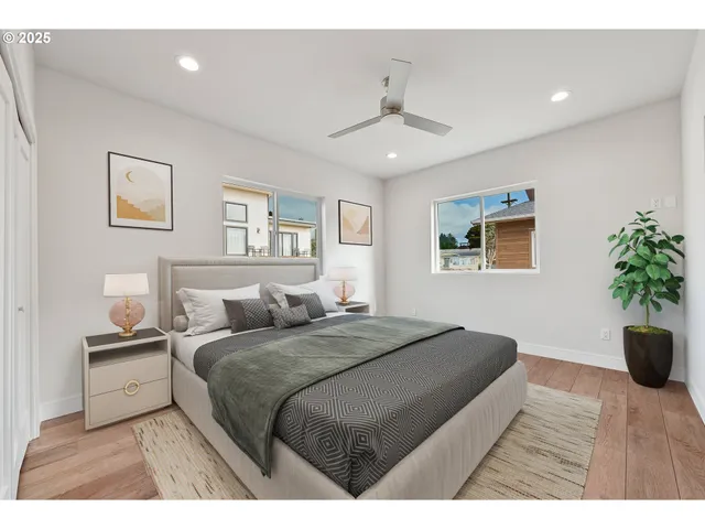 a bedroom with a large bed and a chandelier