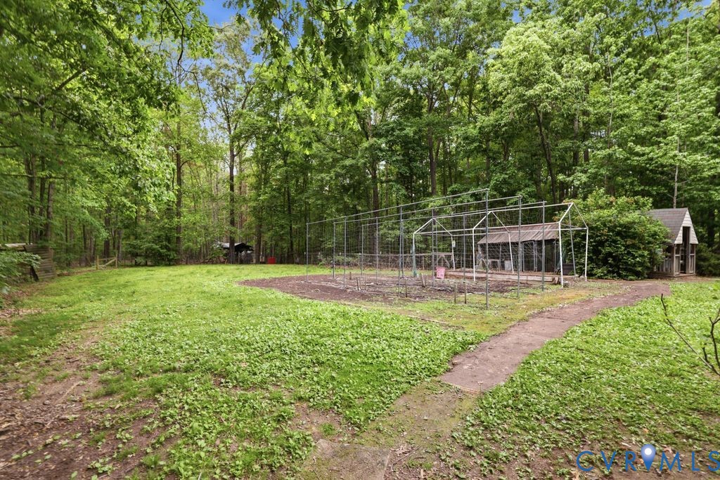 1061 Turkey Ridge Drive Moseley, VA 23120 - Photo 36 of 51 a view of a garden with a patio