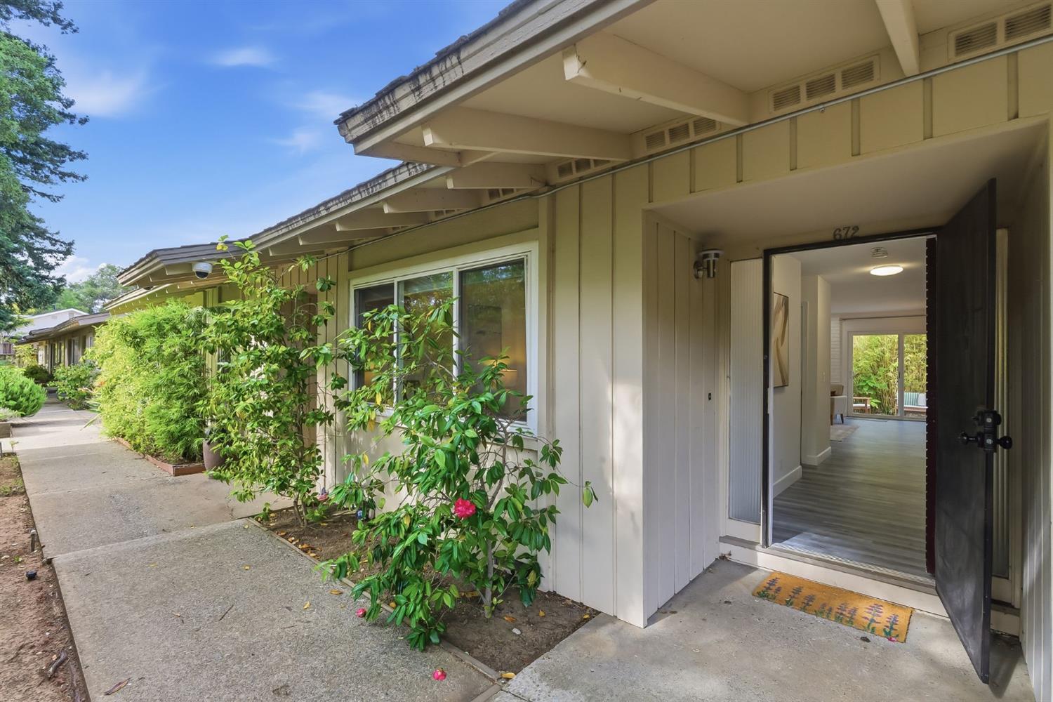672 North San Antonio Road Los Altos, CA 94022 - Photo 1 of 22 a view of a pathway besides a house