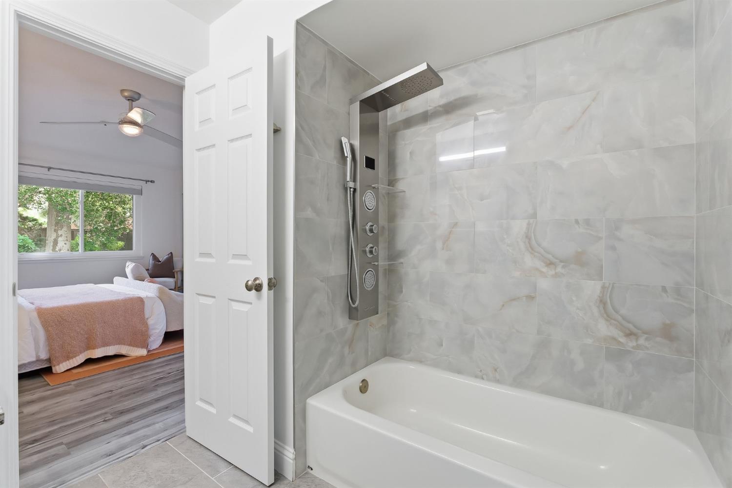 672 North San Antonio Road Los Altos, CA 94022 - Photo 15 of 22 a bathroom with a bathtub and a shower