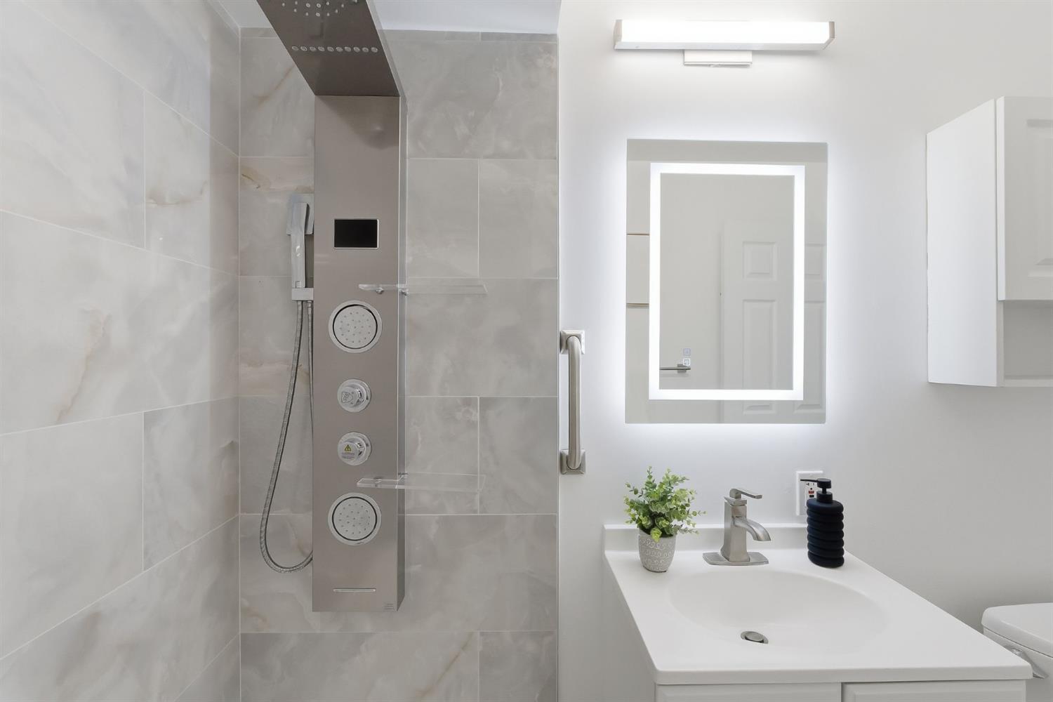 672 North San Antonio Road Los Altos, CA 94022 - Photo 20 of 22 a bathroom with a sink a mirror and shower